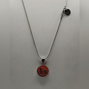 Kate Forty Eight silver tone, orange, enamel  background & a silver b necklace